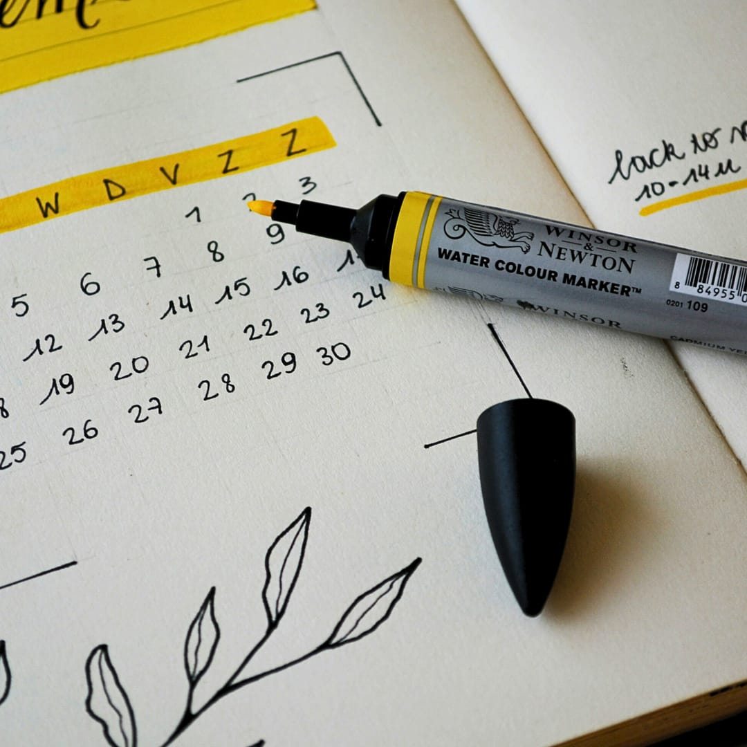 A cozy journal open on a wooden table with a cup of tea, a pen, and soft lighting, symbolizing daily gratitude reflection.